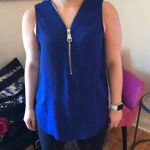 Blue sleeveless top with oversized zipper